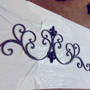 Wrought iron decoration. 31 1/2 wide by 10 1/2 inches long. From hobby lobby.